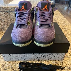 Like new women’s air Jordan 4 retro. Only worn twice.Canyon Purple/Safety Orange